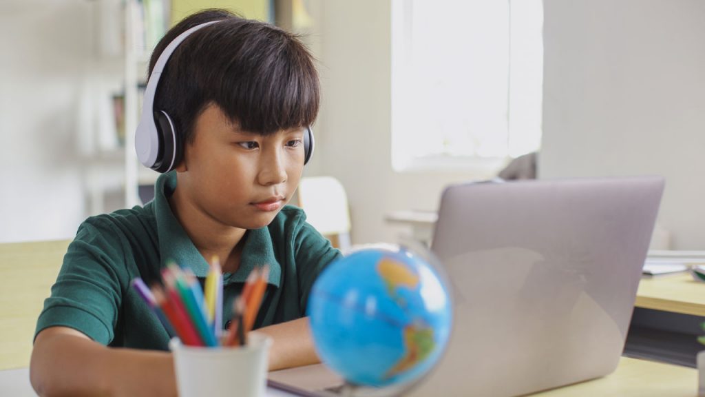 Kid Text-to-speech at a laptop